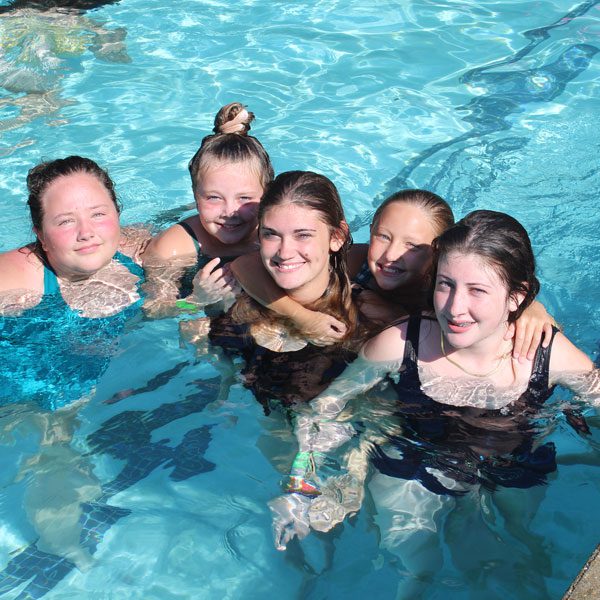 group enjoying the pool
